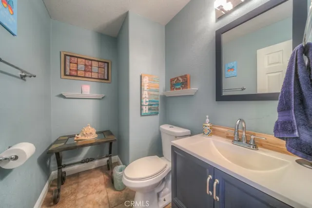 a backyard of a house with fire pit and outdoor seating