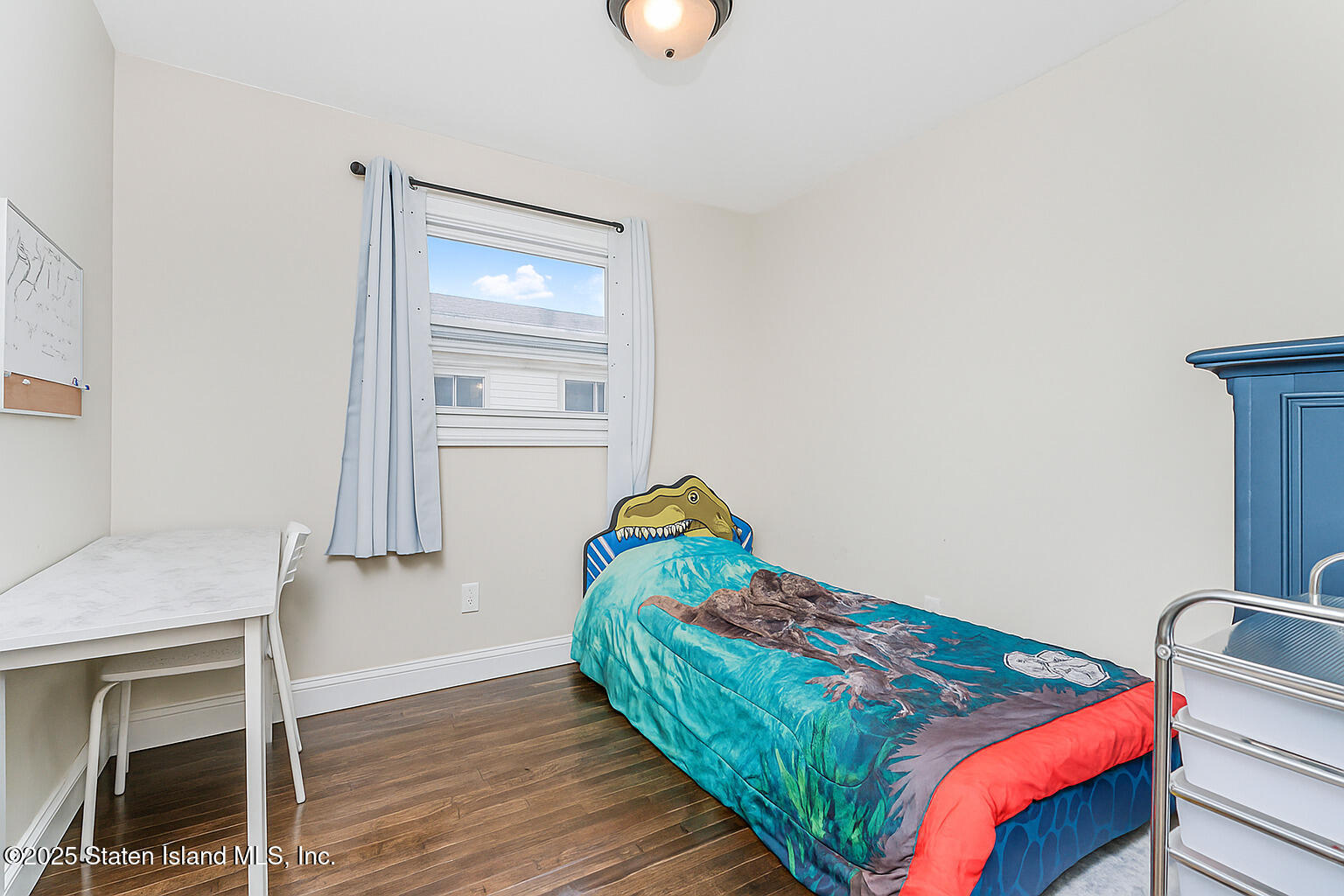 28 Drumgoole Road East Staten Island, NY 10312 - Photo 15 of 28 a bedroom with a bed and window