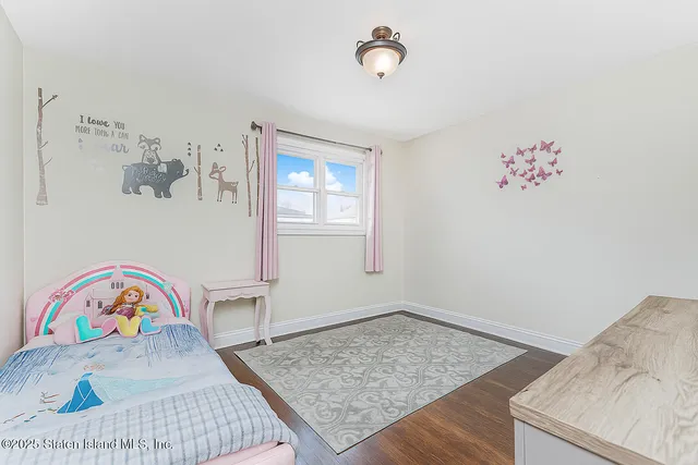 a view of utility room and bedroom