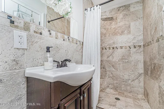 a bathroom with a sink a vanity and a mirror