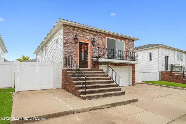 a front view of a house with a garage