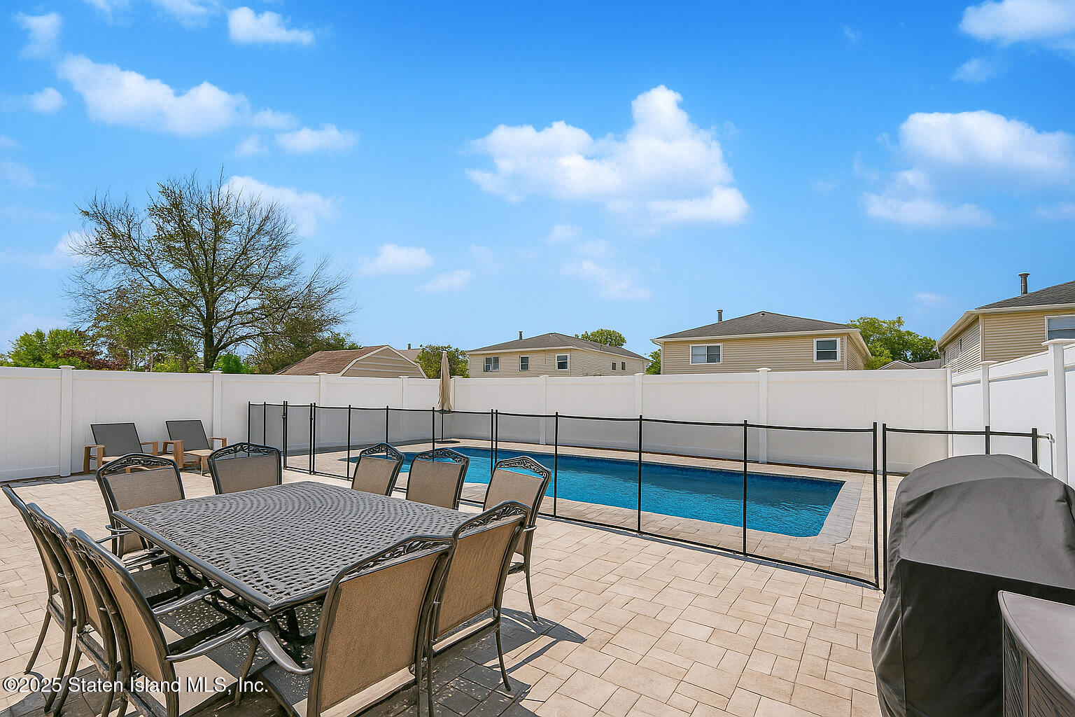 28 Drumgoole Road East Staten Island, NY 10312 - Photo 26 of 28 a view of a terrace with furniture and stove
