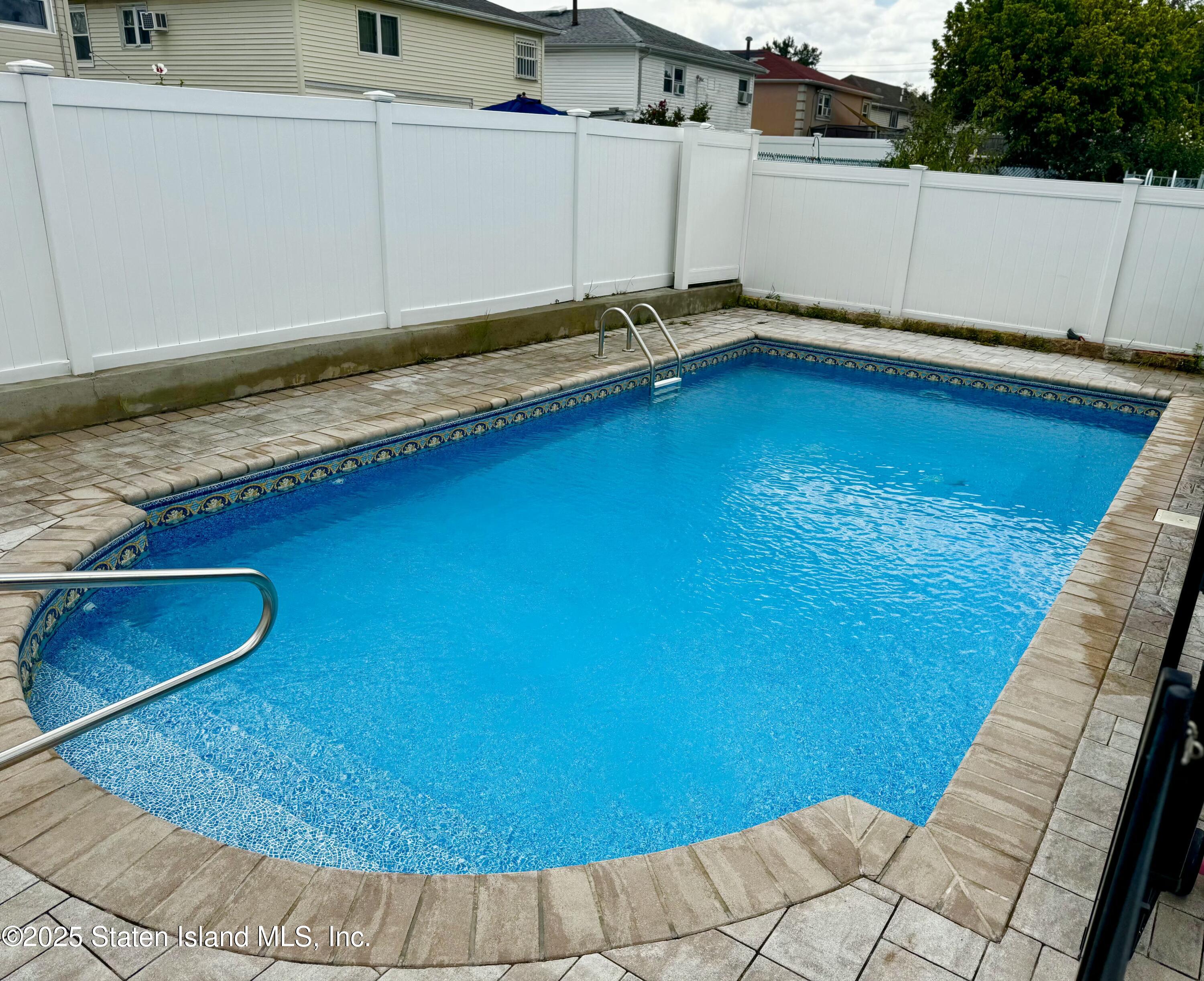 28 Drumgoole Road East Staten Island, NY 10312 - Photo 27 of 28 a view of a backyard with swimming pool