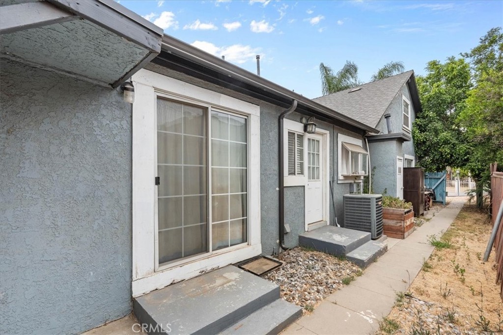 3974 5th Street Riverside, CA 92501 - Photo 7 of 45 a front view of a house with a wooden bench