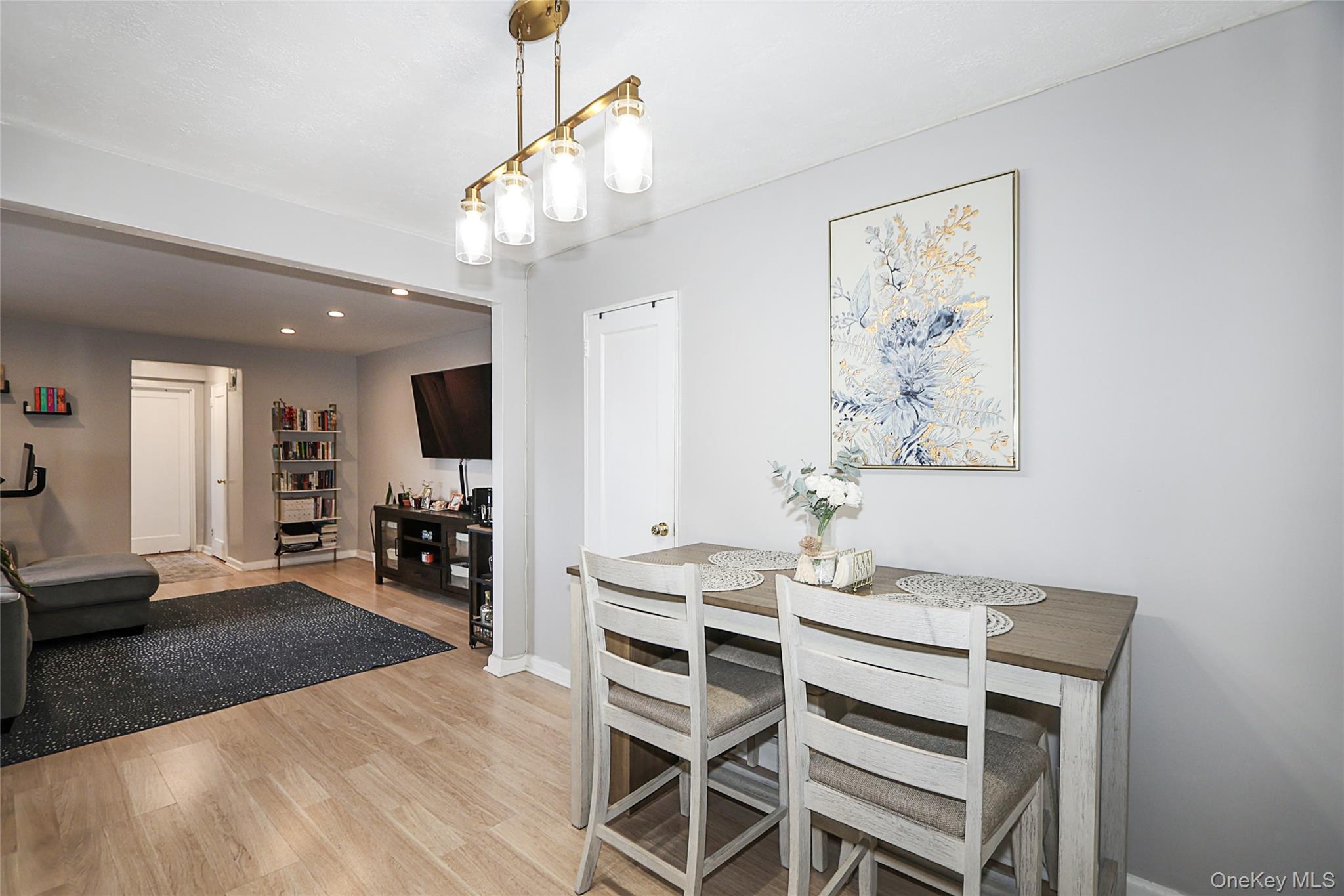 147-10 84th Road, Unit 6K Queens, NY 11435 - Photo 3 of 21 Dining space featuring light wood-style floors and recessed lighting