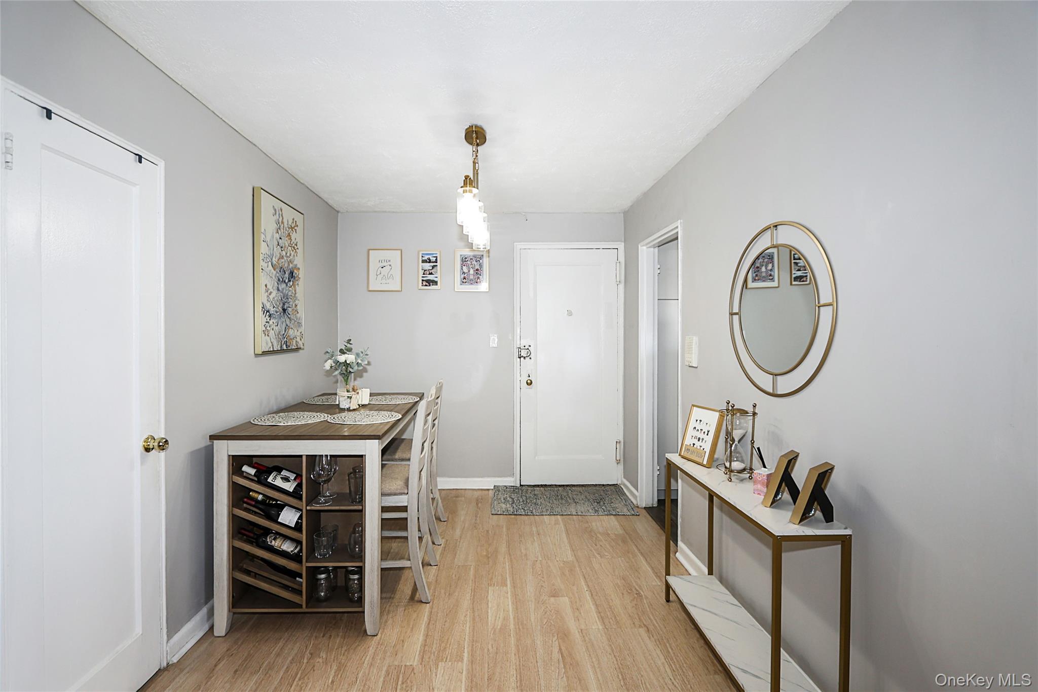 147-10 84th Road, Unit 6K Queens, NY 11435 - Photo 5 of 21 Foyer with light wood-type flooring and baseboards