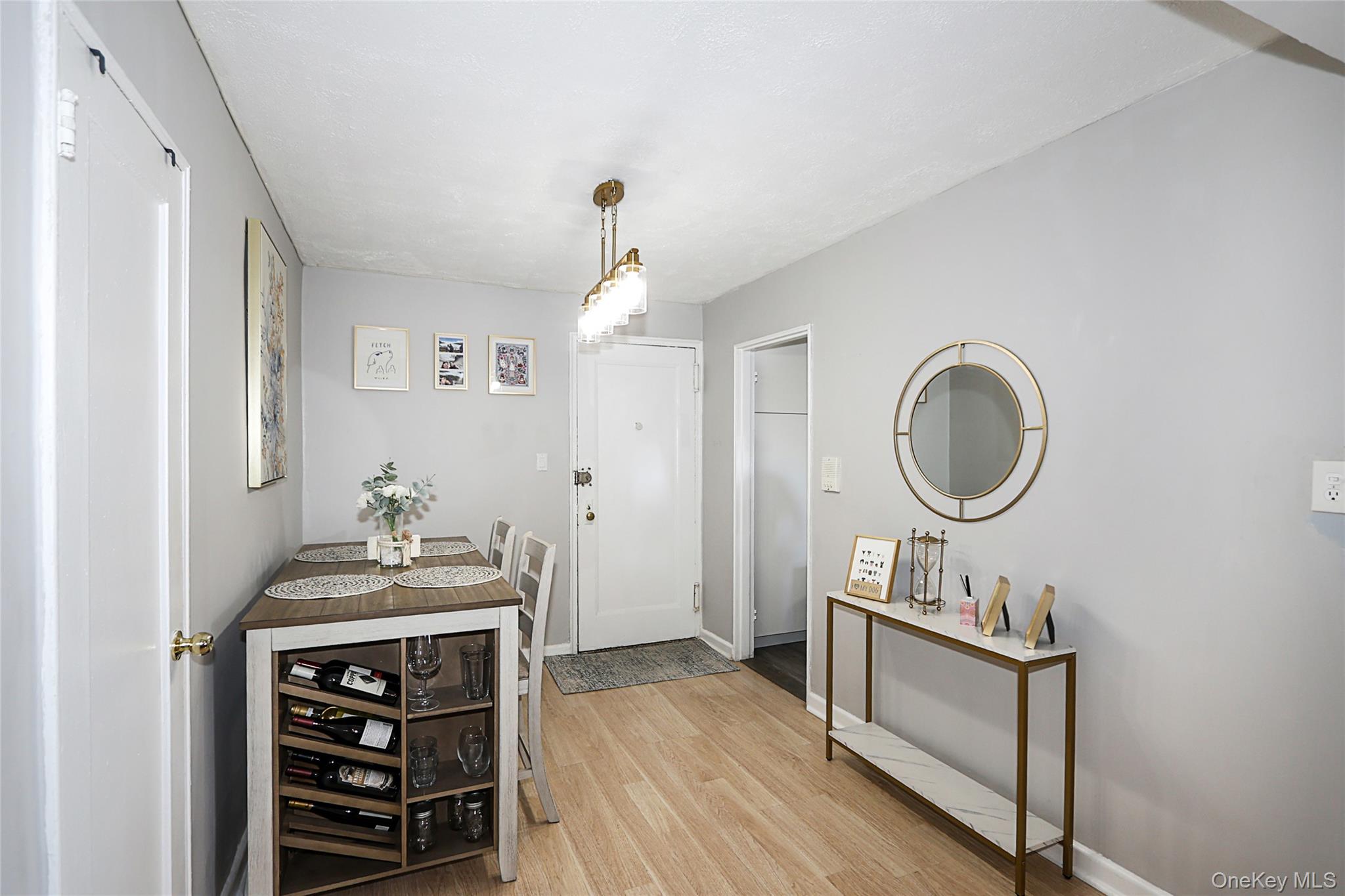 147-10 84th Road, Unit 6K Queens, NY 11435 - Photo 6 of 21 Entrance foyer with light wood finished floors and baseboards