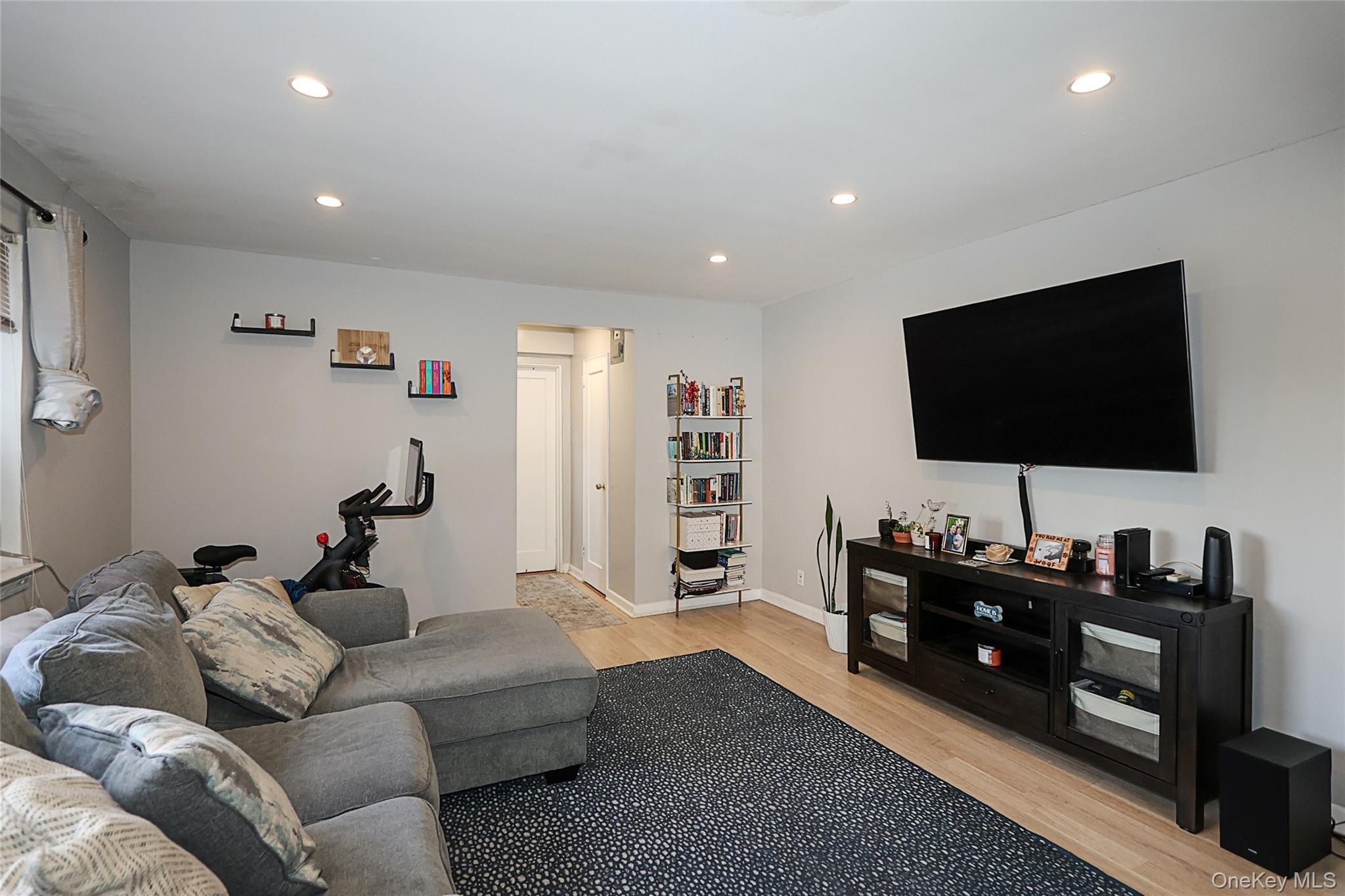 147-10 84th Road, Unit 6K Queens, NY 11435 - Photo 7 of 21 Living room featuring recessed lighting and light wood-style flooring