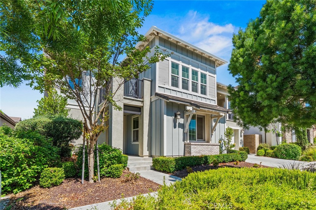 115 Mustard Irvine, CA 92618 - Photo 2 of 74 a front view of a house with a yard