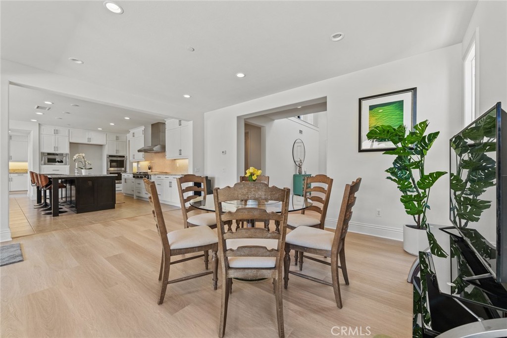 115 Mustard Irvine, CA 92618 - Photo 25 of 74 a dining room with furniture and wooden floor