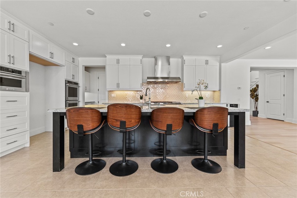 115 Mustard Irvine, CA 92618 - Photo 33 of 74 a kitchen with cabinets and appliances