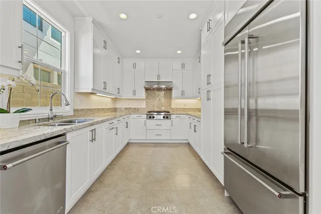 a bedroom with a large bed and a couch