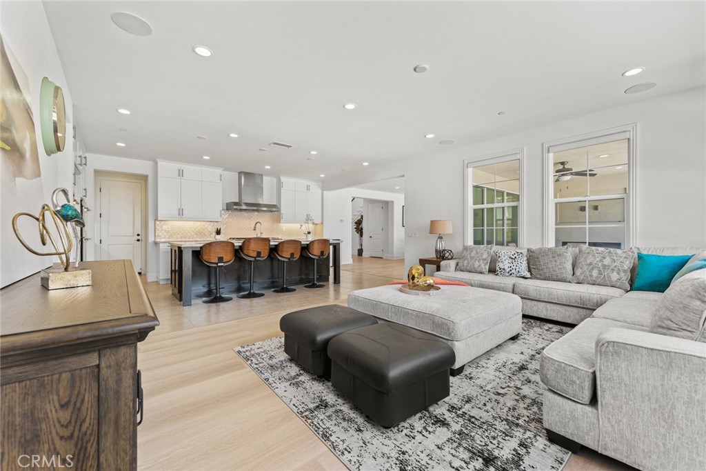 115 Mustard Irvine, CA 92618 - Photo 36 of 74 a living room with furniture kitchen view and a couch
