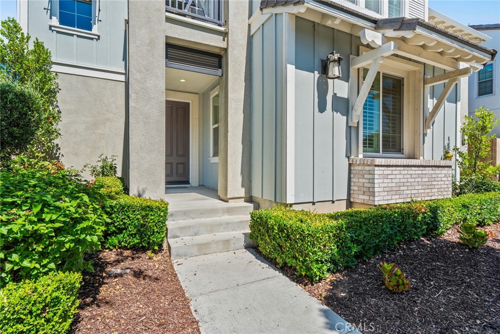 115 Mustard Irvine, CA 92618 - Photo 4 of 74 a view of a brick house with potted plants