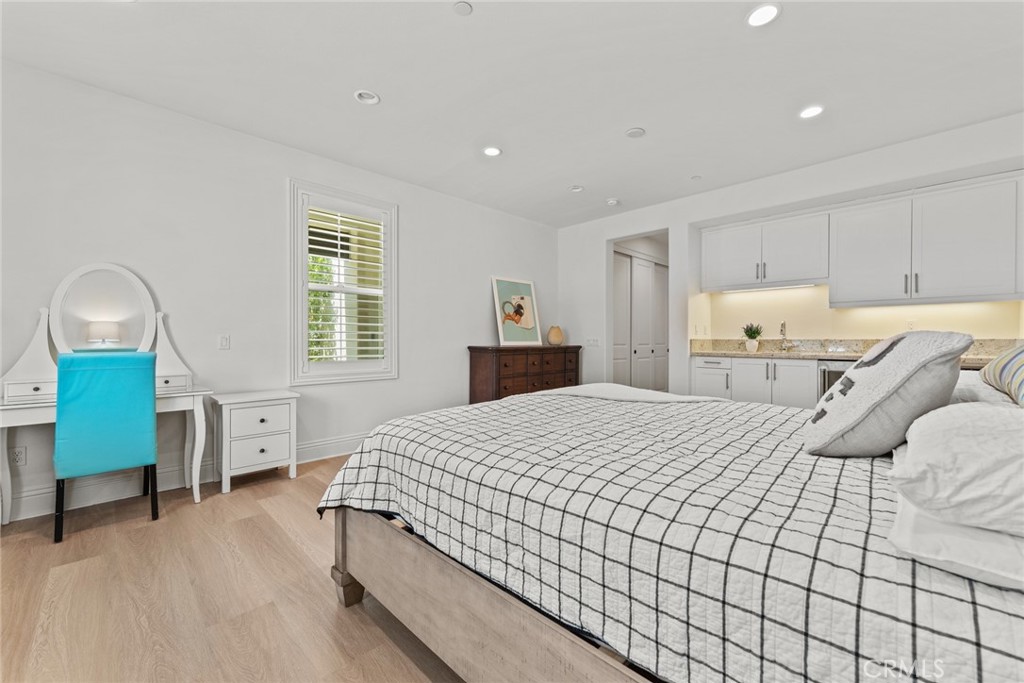 115 Mustard Irvine, CA 92618 - Photo 42 of 74 a bedroom with a bed and a dresser