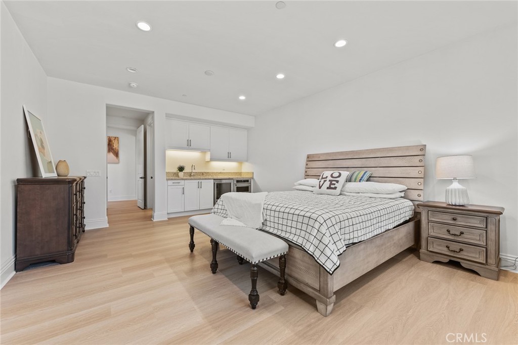 115 Mustard Irvine, CA 92618 - Photo 43 of 74 a bedroom with a bed and a flat screen tv