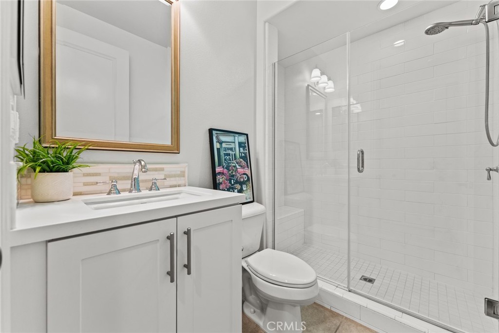 115 Mustard Irvine, CA 92618 - Photo 45 of 74 a bathroom with a sink and a mirror