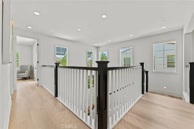 a bedroom with a bed and a mirror