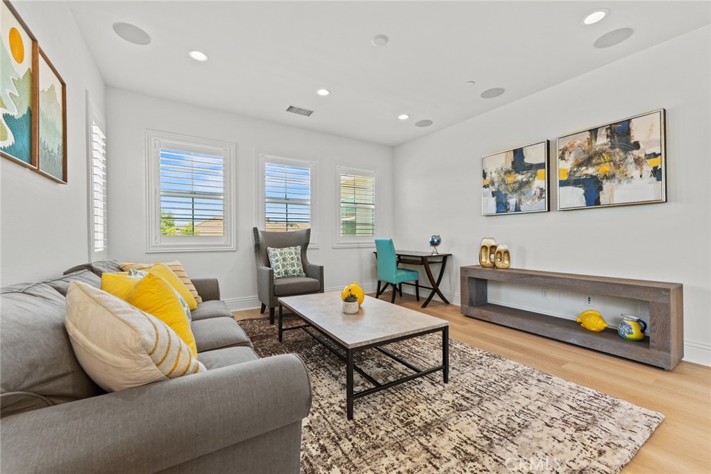115 Mustard Irvine, CA 92618 - Photo 50 of 74 a living room with furniture and a rug