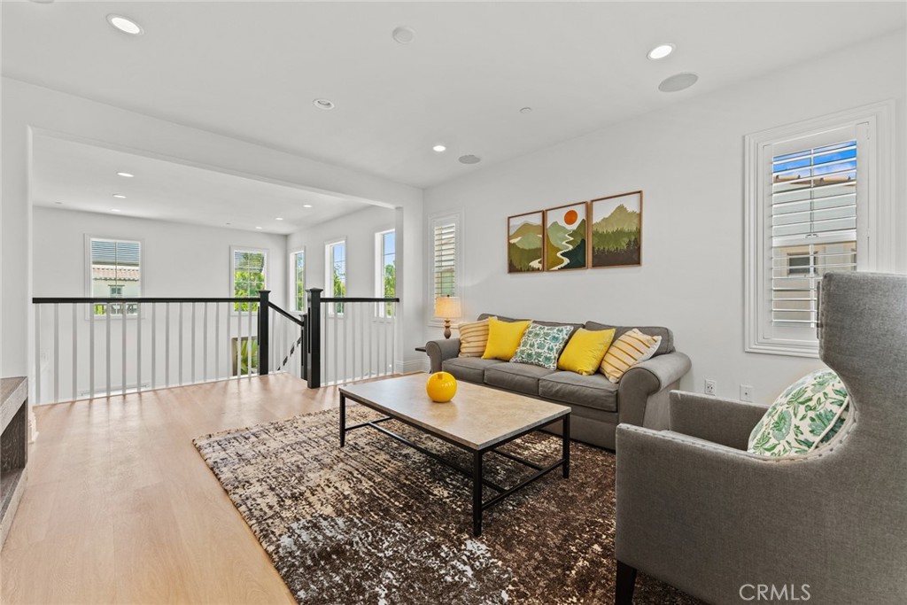 115 Mustard Irvine, CA 92618 - Photo 53 of 74 a living room with furniture and wooden floor