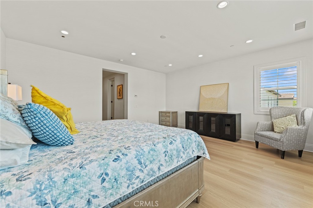 115 Mustard Irvine, CA 92618 - Photo 54 of 74 a bedroom with a large bed and a couch