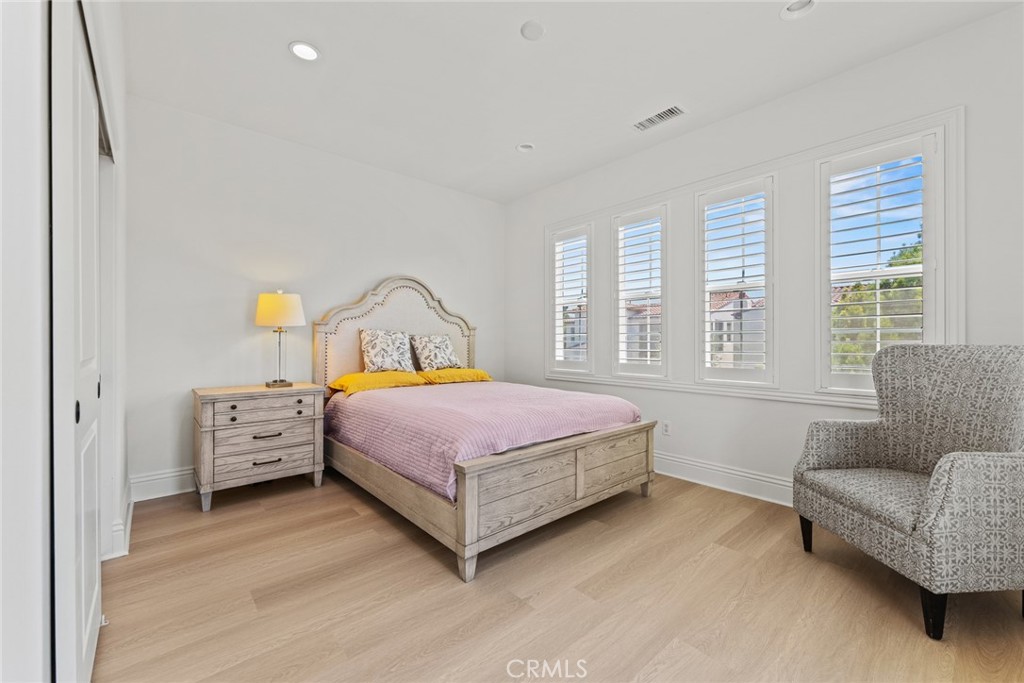 115 Mustard Irvine, CA 92618 - Photo 62 of 74 a bedroom with a bed and a couch