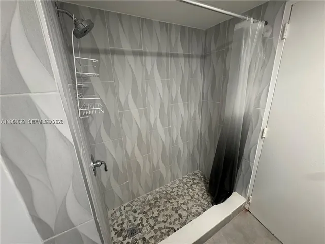 a view of wooden floor and curtain