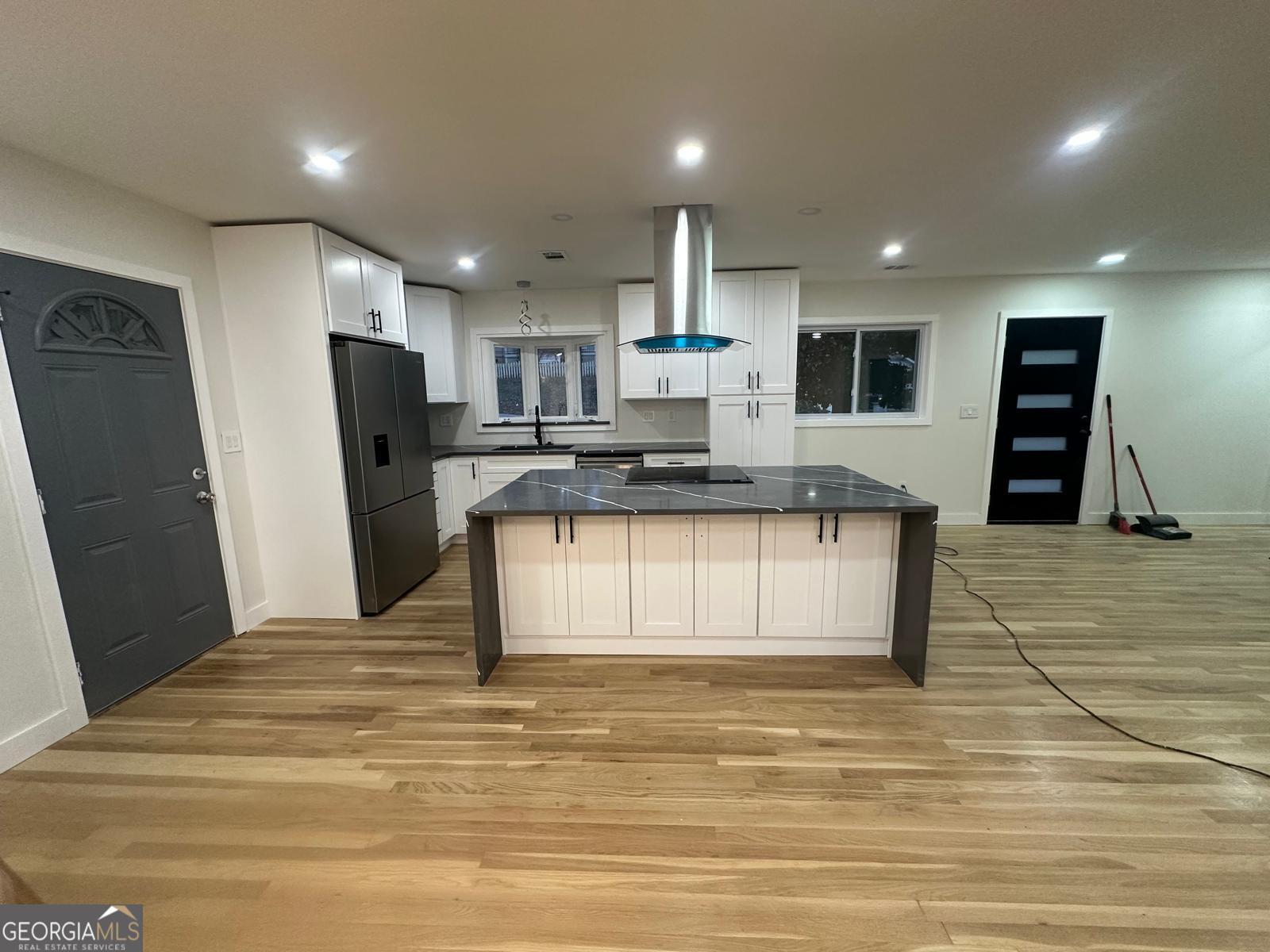 42 West Belle Isle Road Northeast Sandy Springs, GA 30342 - Photo 5 of 5 a view of kitchen with refrigerator microwave and cabinets