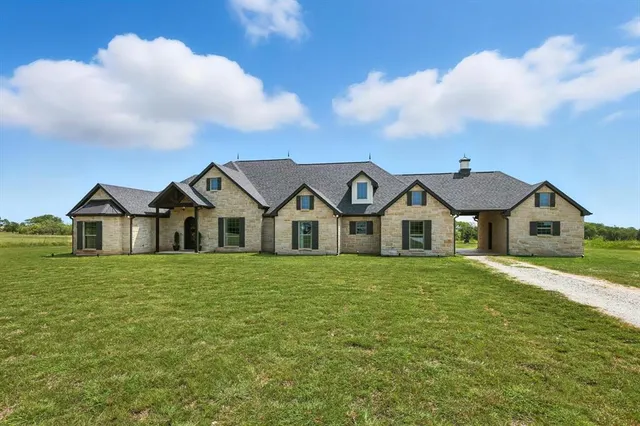 a front of a house with a yard
