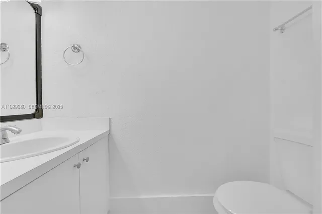 a bathroom with a toilet and a sink