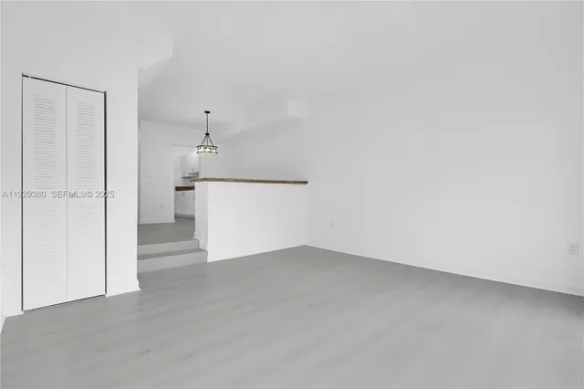 a view of a kitchen with a dishwasher and a refrigerator