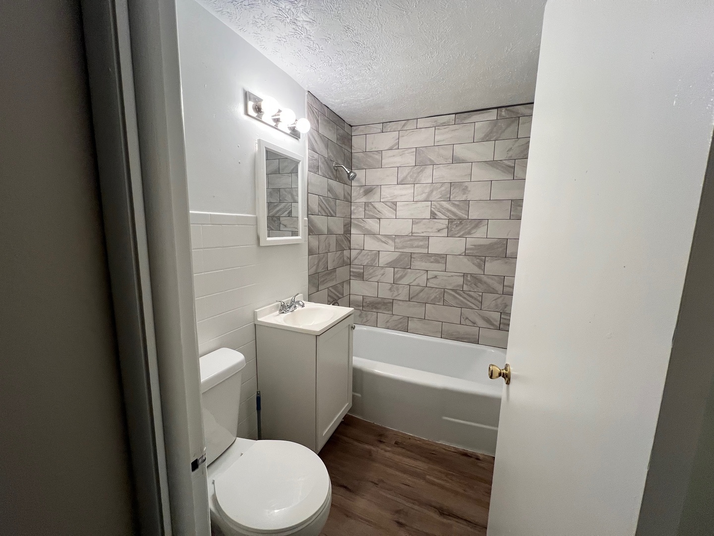 2410 Auburn Street, Unit 2 Rockford, IL 61103 - Photo 7 of 9 a bathroom with a toilet and a shower