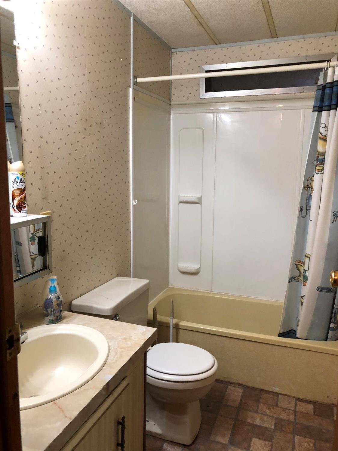6226 East Evans Creek Road, Unit 15 Rogue River, OR 97537 - Photo 26 of 30 a bathroom with a sink toilet and shower