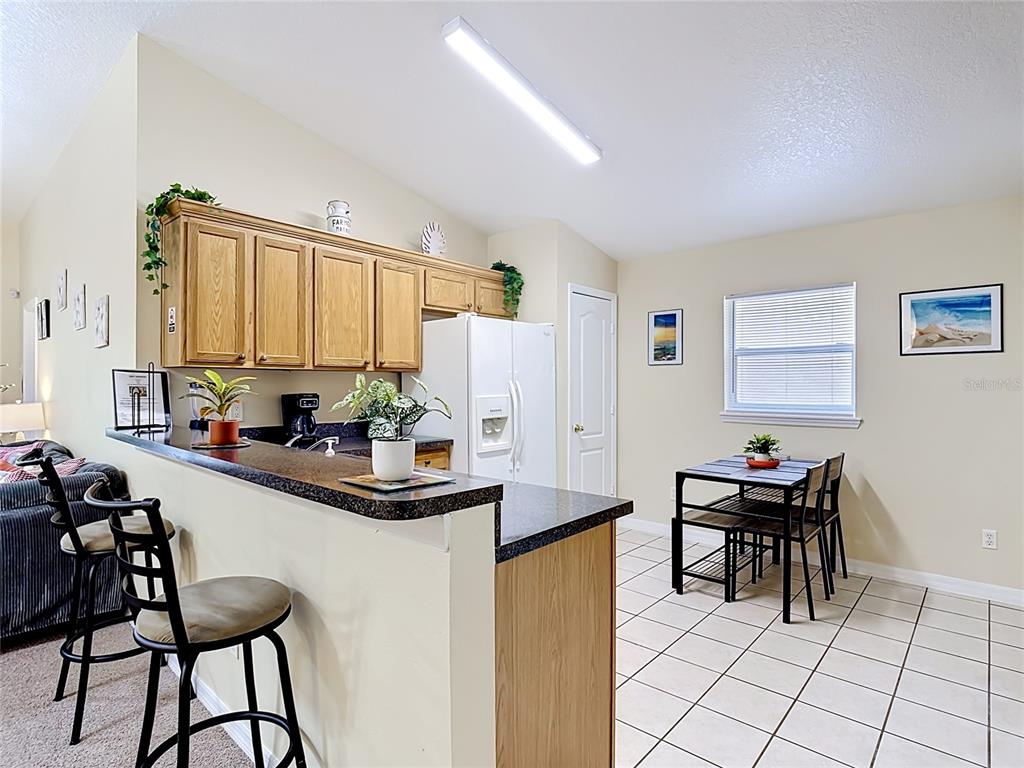 522 Sandy Ridge Drive Davenport, FL 33896 - Photo 11 of 34 a dining room with furniture and window