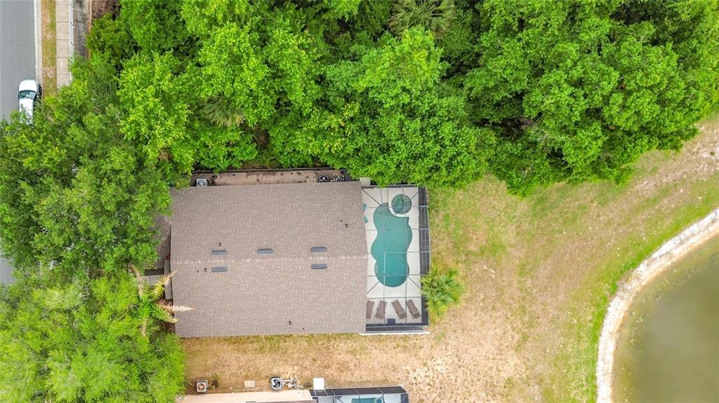 522 Sandy Ridge Drive Davenport, FL 33896 - Photo 34 of 34 a view of a house with a yard and large tree
