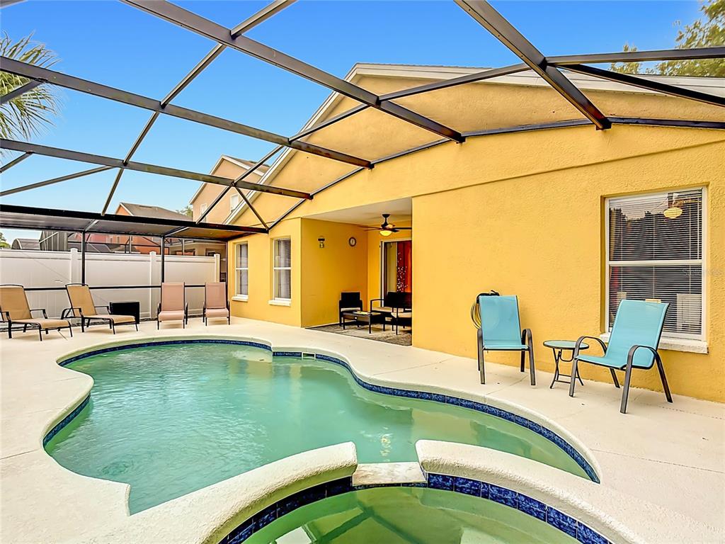 522 Sandy Ridge Drive Davenport, FL 33896 - Photo 4 of 34 a view of a swimming pool with a patio