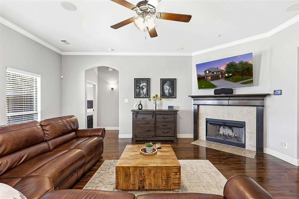 1105 Safrano Street Midlothian, TX 76065 - Photo 9 of 25 a living room with furniture and a fireplace