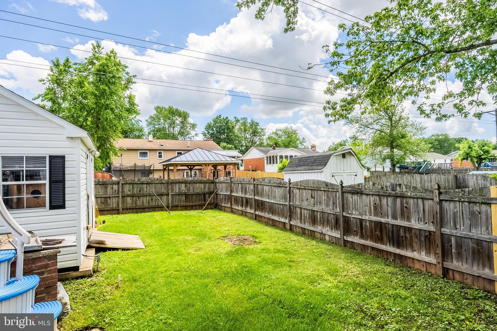 9722 Copeland Drive Manassas, VA 20109 - Photo 15 of 46 a view of a backyard with a garden and deck