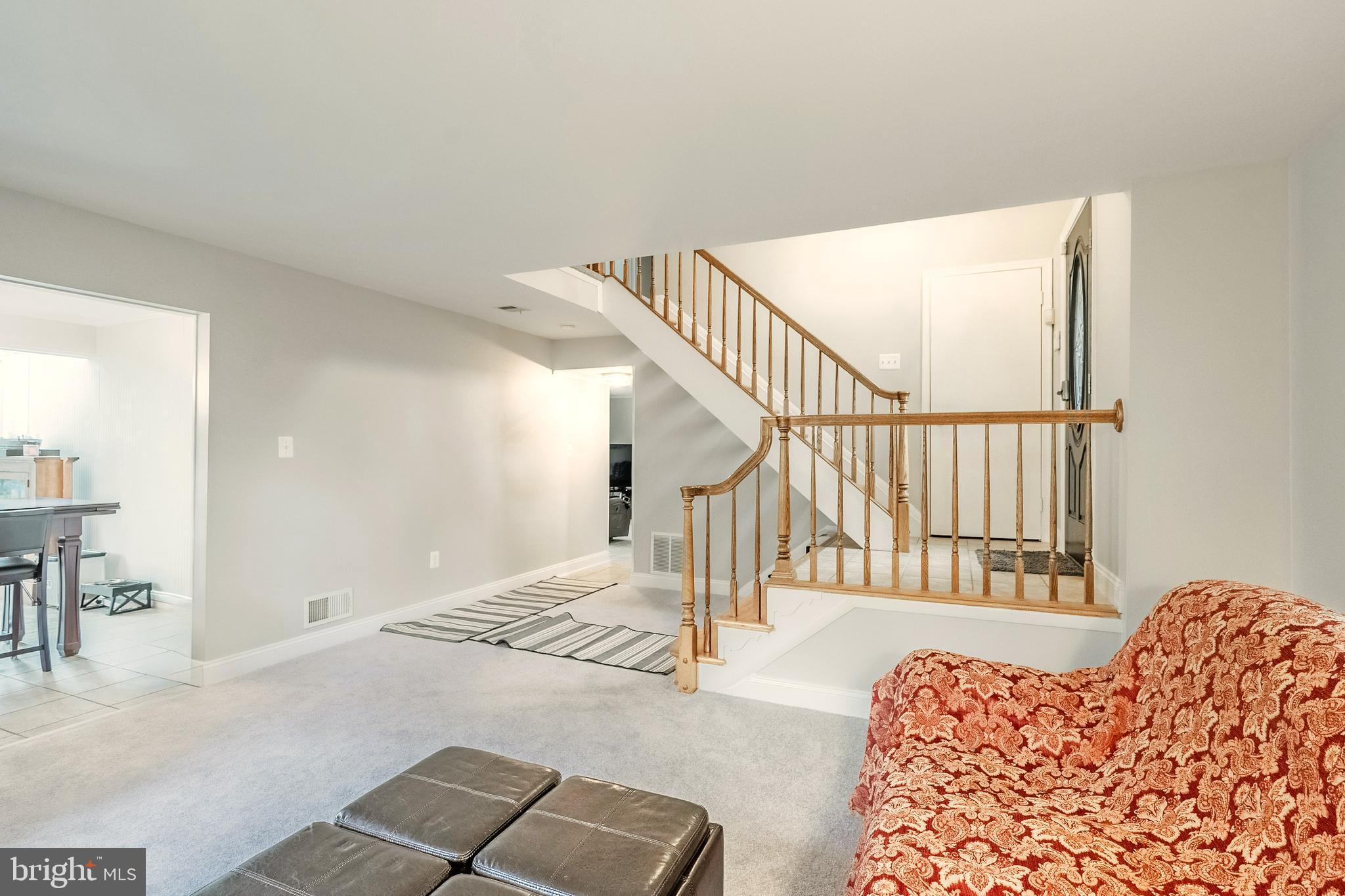 9722 Copeland Drive Manassas, VA 20109 - Photo 18 of 46 a view of a hallway with wooden floor and stairs