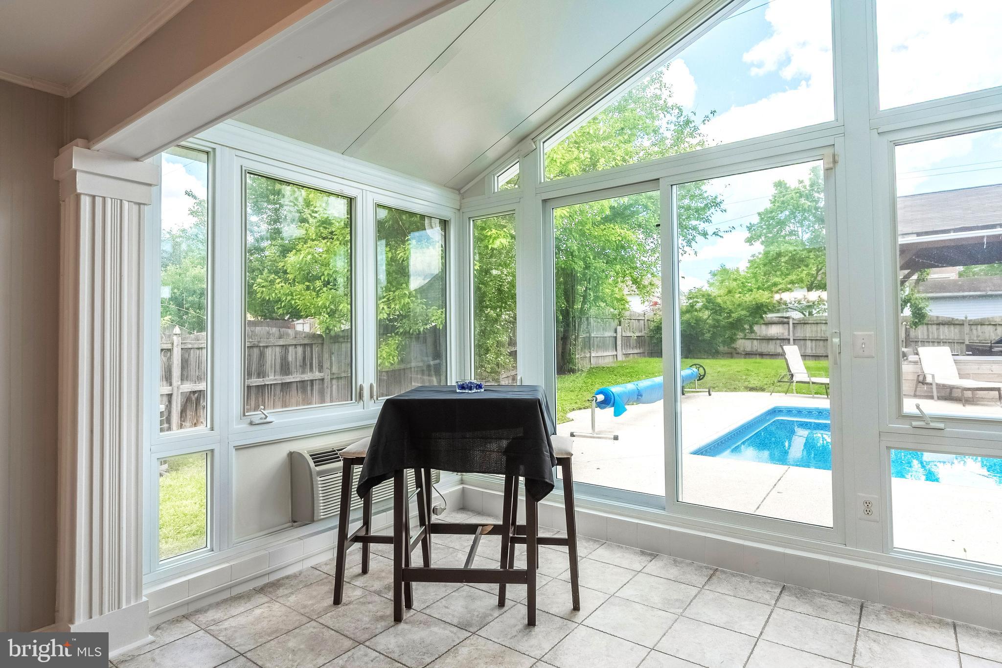9722 Copeland Drive Manassas, VA 20109 - Photo 23 of 46 a dining area with glass top table and windows