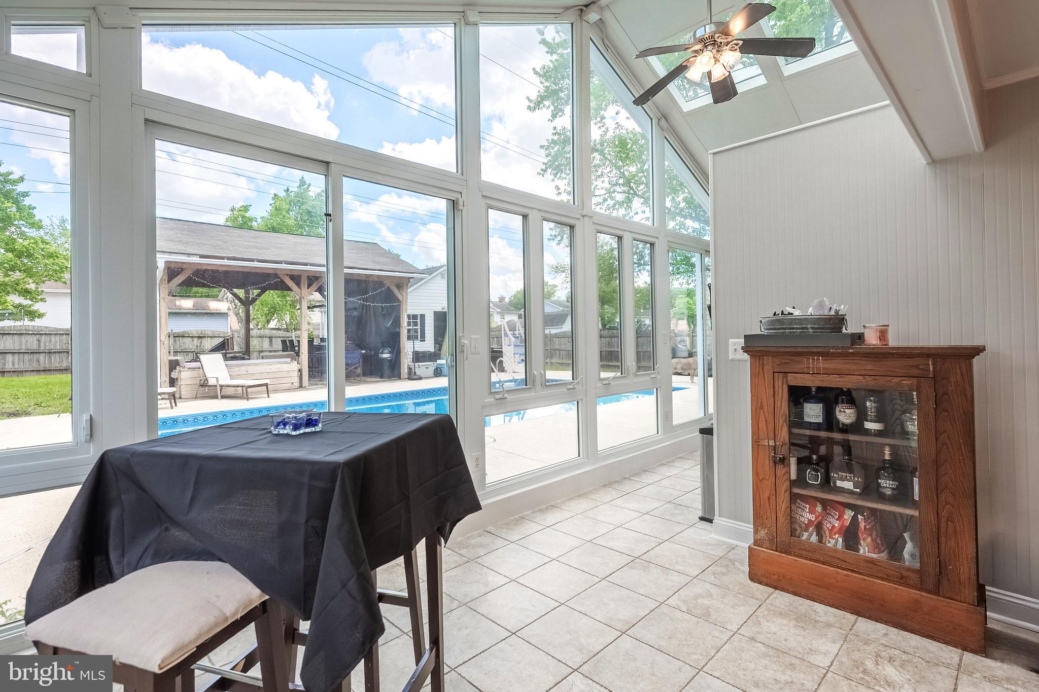 9722 Copeland Drive Manassas, VA 20109 - Photo 24 of 46 a dining room with furniture a chandelier and wooden floor