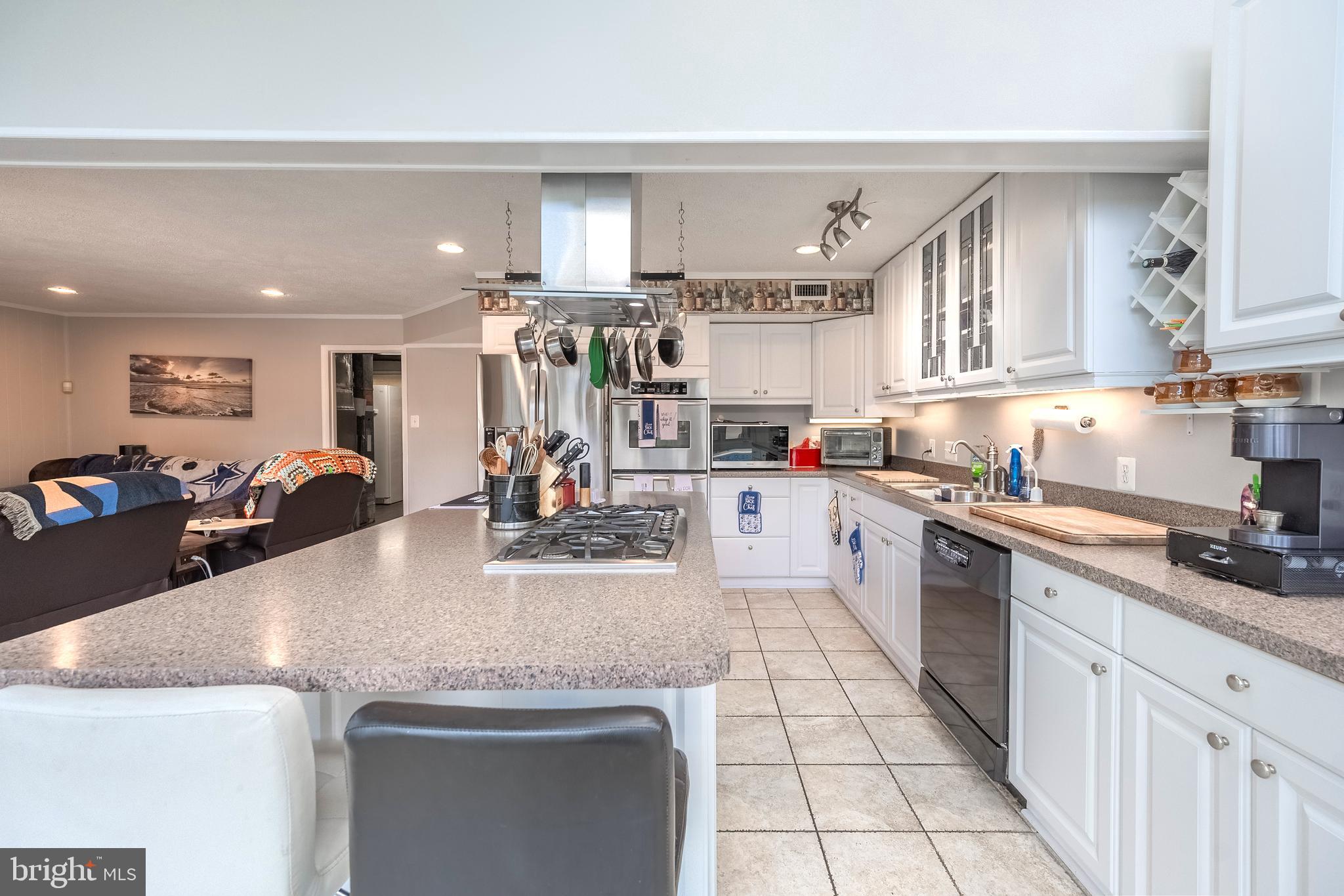 9722 Copeland Drive Manassas, VA 20109 - Photo 26 of 46 a kitchen with stainless steel appliances granite countertop a sink stove and cabinets
