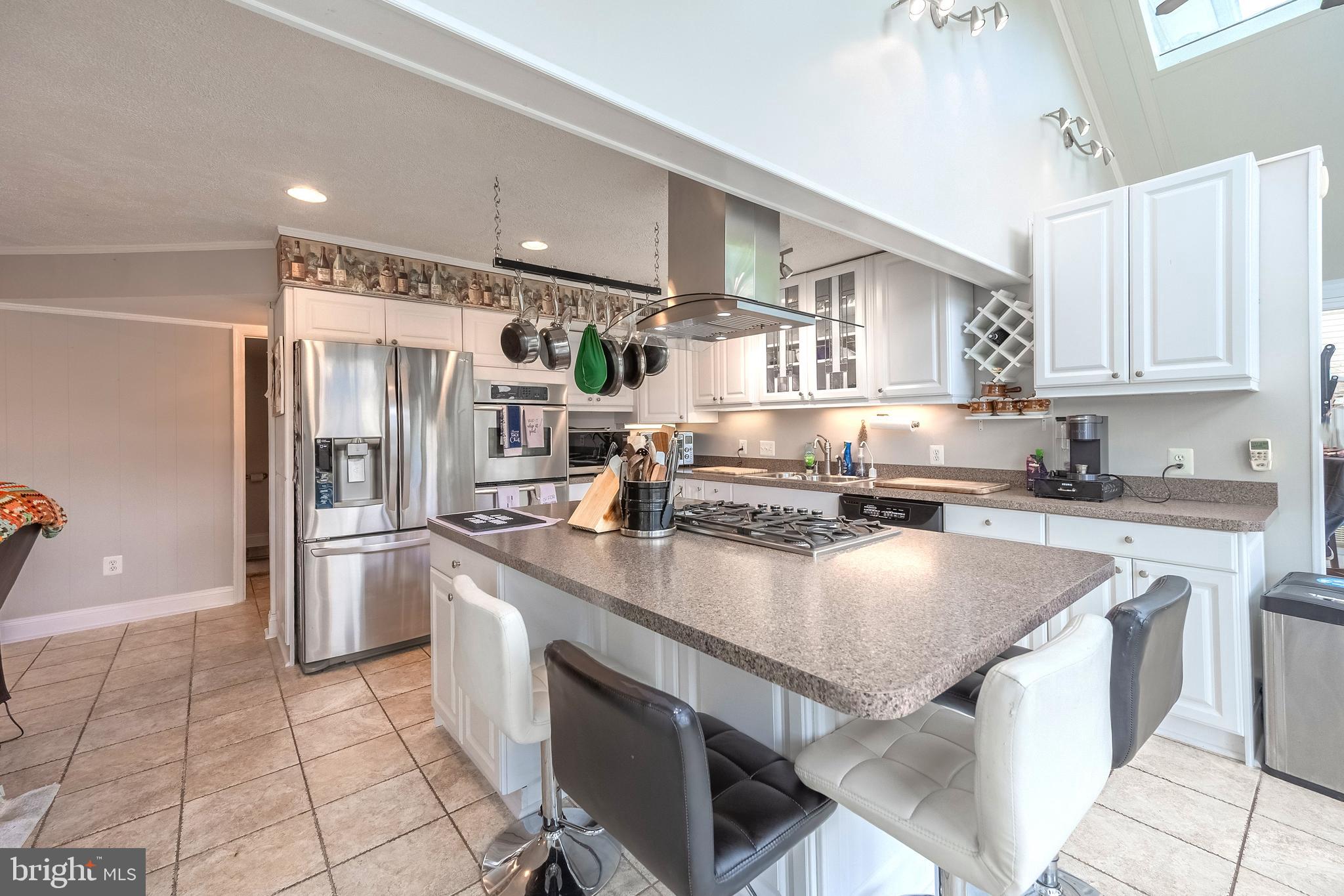 9722 Copeland Drive Manassas, VA 20109 - Photo 27 of 46 a kitchen with stainless steel appliances granite countertop a sink stove and refrigerator