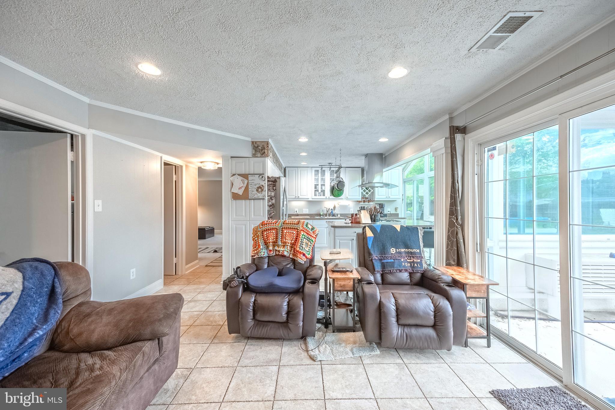 9722 Copeland Drive Manassas, VA 20109 - Photo 31 of 46 a living room with furniture and a table