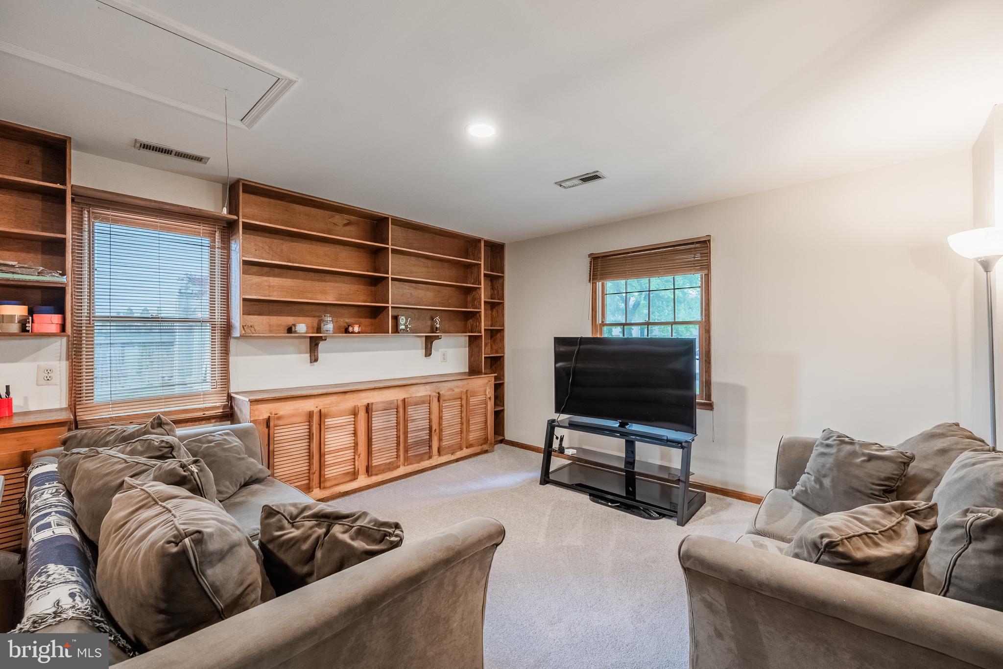 9722 Copeland Drive Manassas, VA 20109 - Photo 32 of 46 a living room with furniture and a flat screen tv