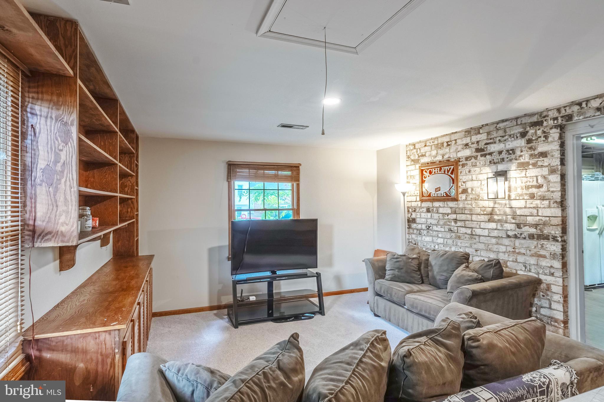 9722 Copeland Drive Manassas, VA 20109 - Photo 33 of 46 a living room with furniture a ceiling fan and a window