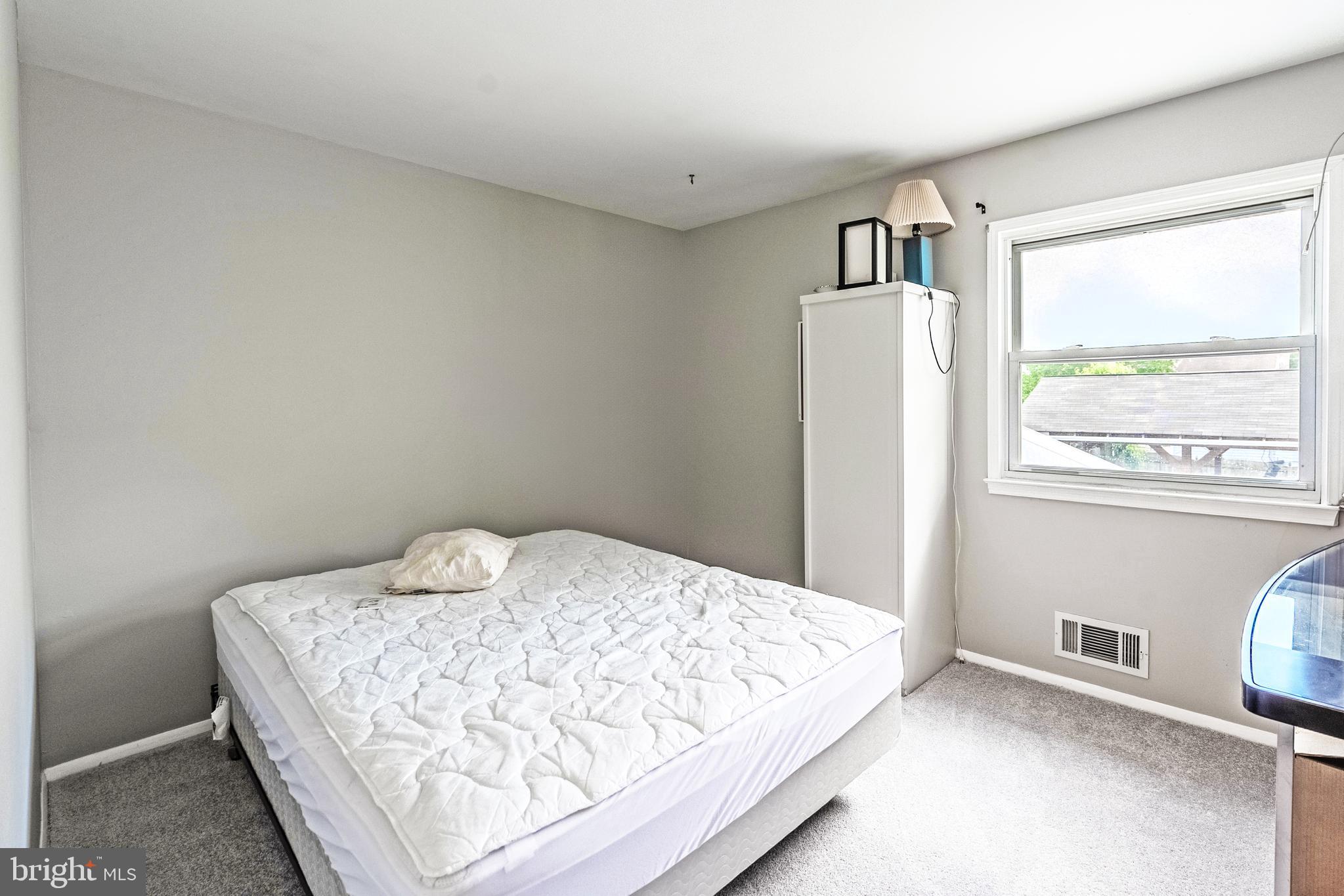 9722 Copeland Drive Manassas, VA 20109 - Photo 40 of 46 a bedroom with a bed and a window