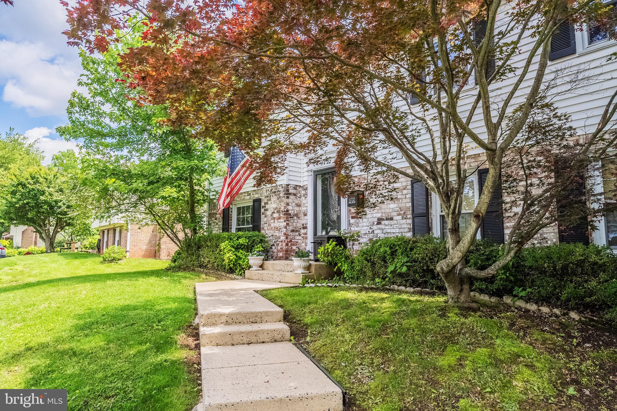 9722 Copeland Drive Manassas, VA 20109 - Photo 4 of 46 a front view of a house with garden