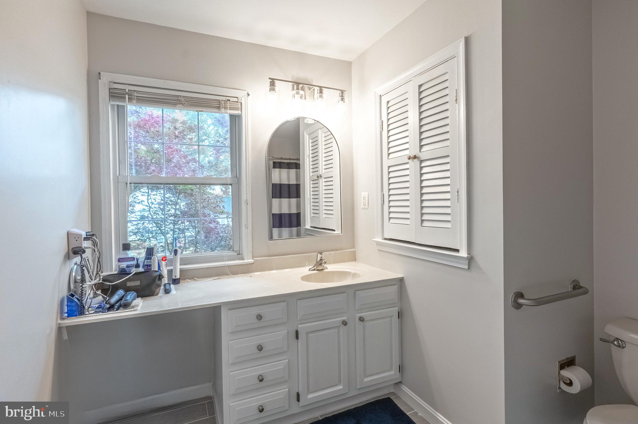 9722 Copeland Drive Manassas, VA 20109 - Photo 41 of 46 a bathroom with a double vanity sink and a window