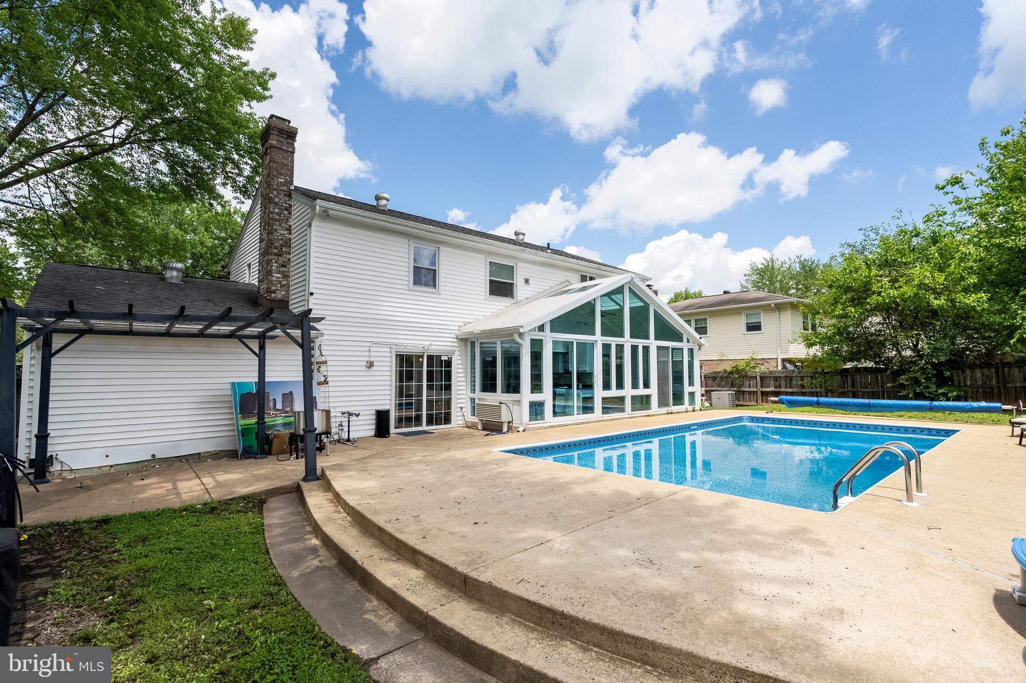 9722 Copeland Drive Manassas, VA 20109 - Photo 5 of 46 a view of a house with pool and a yard